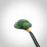 British Columbian jade turtle pendant. Hand carved jade turtle pendant, made by NZ Pacific for sale online. Unique handmade jewellery. Provided with an adjustable cord and packaged in a woven kete pouch.