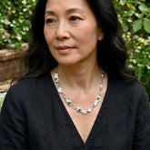 Woman wearing jade and silver necklace