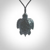 New Zealand jade turtle pendant. Hand carved jade turtle pendant, made by NZ Pacific for sale online. Unique handmade jewellery. Provided with an adjustable cord and packaged in a woven kete pouch.