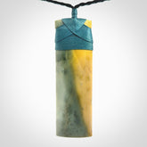 This is a lovely, one-off large, green toki pendant we've made from a gorgeous New Zealand jade. It is finished in a matte sheen and is bound with our plaited cord. These are wonderful pieces that are very attractive and will last a lifetime.
