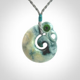 Guatemalan Jadeite Koru Manaia pendant. Made in New Zealand. Real Jade, pounamu. Real New Zealand Jade Manaia with Koru necklace with a polished finish.