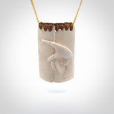 Hand carved large bone drop with hand carving. A stunning work of art. This pendant is hand carved in bone and provided with an adjustable cord. A one off work of art to wear by NZ Pacific.