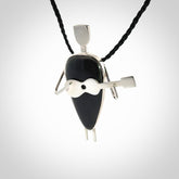 This is a very cool and creative guitarist hand made from Australian Black Jade and Sterling Silver. A guitar playing person hand crafted from sterling silver with Black Jade torso. A spectacular piece of art to wear.