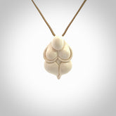 Hand carved mammoth tusk goddess pendant. Hand carved Mammoth Tusk jewellery for sale online by NZ Pacific. Delivered with a fine adjustable cord and packaged in a woven kete pouch.