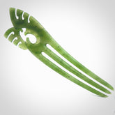 A hand carved New Zealand Jade Heru comb. A large hand made Heru combe by New Zealand artist Kerry Thompson. Kerry has carved two Haast eagles at the top of the comb - this is an exquisite work of art and would be perfect for an enthusiasts collection.