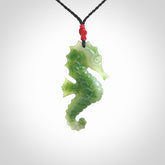 A hand carved seahorse pendant. We have carved this from beautiful nephrite jade and we bind them with our hand-plaited cords. We ship these worldwide with express courier anywhere in the world.
