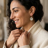 Woman wearing bone earrings