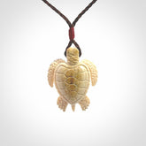 This is a beautiful hand carved woolly mammoth tusk turtle pendant. A really cool piece that is made from this rare and beautiful material. The mammoth has a very distinctive grain and each piece is different. We ship this worldwide and the cost of shipping is included in the price.