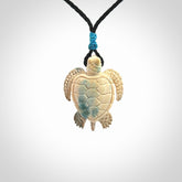 This is a beautiful hand carved woolly mammoth tusk turtle pendant. A really cool piece that is made from this rare and beautiful material. The mammoth has a very distinctive grain and each piece is different. We ship this worldwide and the cost of shipping is included in the price.
