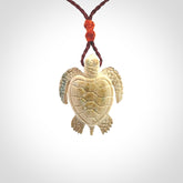 This is a beautiful hand carved woolly mammoth tusk turtle pendant. A really cool piece that is made from this rare and beautiful material. The mammoth has a very distinctive grain and each piece is different. We ship this worldwide and the cost of shipping is included in the price.