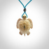 This is a beautiful hand carved woolly mammoth tusk turtle pendant. A really cool piece that is made from this rare and beautiful material. The mammoth has a very distinctive grain and each piece is different. We ship this worldwide and the cost of shipping is included in the price.