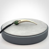 Hand crafted sterling silver with jade huia pendant