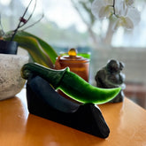 Hand carved large New Zealand Flower Jade knife with koru carving displayed in a Argillite stone stand sculpture. Hand carved here in New Zealand by Ric Moor. This is a 'one only' sculpture, a beautiful display piece.