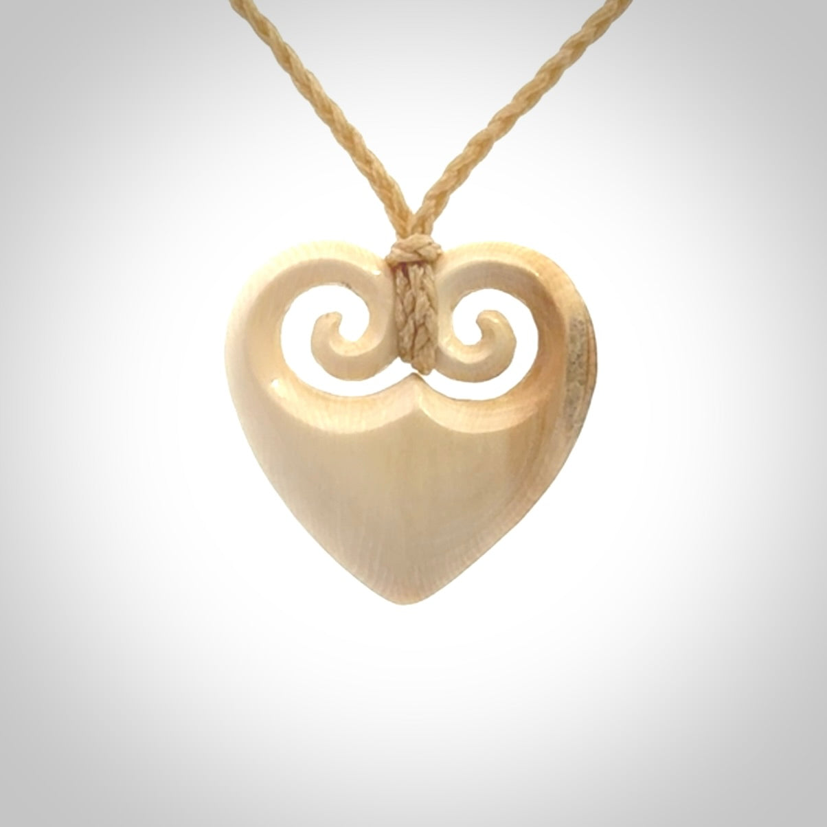 Hand carved heart pendant. Hand made from woolly mammoth tusk. Hand made jewellery for sale online. Rare and unique handmade jewellery. Made by NZ Pacific.