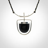 Black jade and silver pendant