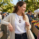Woman wearing jasper heart pendant