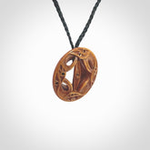 Hand carved Japanese design pendant. Yuri Terenyi has carved this from Bone and stained it with his homemade dye. This is a delightful, medium sized and artistic piece of jewellery. One only necklace.