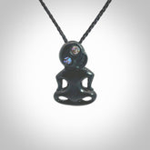 This pendant is a small jade tiki pendant. The carving shows wonderful detail on the front while the back is beautifully rounded. These are carved in New Zealand Jade with paua shell eyes. The cord is adjustable in length. Provided in a woven kete pouch and shipped worldwide.