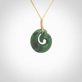 This picture shows a koru pendant, hand carved from New Zealand jade. We will provide this with an adjustable plaited cord. This has been hand carved by Kyohei Noguchi. One only pendant, shipped to you with express courier.