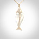 Hand carved bone fish skeleton pendant. Hand made bone fish necklace. Fish themed jewellery. Ocean themed pendant. One only necklace provided with adjustable cord and free delivery.