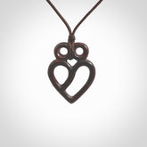 This is a hand carved love heart pendant made from a gorgeous and striking piece of red jasper stone. This is a superbly carved and very unique piece if custom jewellery. For sale online from NZ Pacific. Provided with an adjustable chocolate brown cord and packaged in a woven kete pouch.