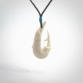 This is a beautiful bone carving pendant. We have designed a hook with a Kingfish motif especially for those lover of the ocean and all you fanatical fishermen out there. This piece is designed and made by NZ Pacific and is for sale worldwide.