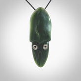 Hand carved New Zealand Jade squid pendant. Hand made Jade Squid pendant with Mother of Pearl eyes, provided with black adjustable cord.