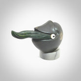 Hand carved New Zealand Jade Nautilus sculpture with Argillite, Bone and Buffalo Horn eyes and Marble stand. Hand made Jade Nautilus sculpture.