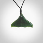 Hand carved small New Zealand Jade whale tail pendant. Carved for NZ Pacific. Handmade ocean themed jewellery for sale online. Hand made by Kyohei Noguchi.
