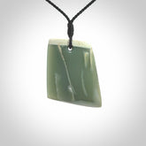 This is a lovely New Zealand Inanga Jade, pounamu Toki drop pendant. Hand carved for us by Kyohei Noguchi. It is bound with an adjustable black coloured cord which is length adjustable. Free worldwide shipping.