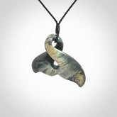 This whale tail twist pendant, is carved from a very striking New Zealand Nelson jade.