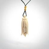 Hand carved Kowhai flower. These are made from Woolly Mammoth tusk and are a soft golden brown colour. They are provided with a hand plaited, adjustable cord. Shipping is free worldwide.
