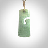 Hand made New Zealand Kokopu jade toki with koru pendant. Hand carved in New Zealand by Kerry Thompson. Hand made jewellery. Unique Jade Toki with adjustable cord. Free shipping worldwide.
