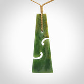 Hand made New Zealand jade toki with double koru pendant. Hand carved in New Zealand by Kerry Thompson.