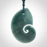 Hand carved Guatemalan Jade koru pendant.