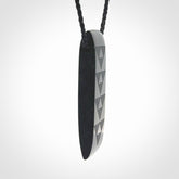 Hand made New Zealand Tangiwai toki with engraving pendant. Hand carved in New Zealand by Kerry Thompson. Unique Jade Toki with adjustable cord.