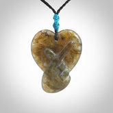 This is a hand carved love heart pendant made from Labradorite stone.