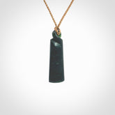 This pendant is a New Zealand jade single twist. It is hand carved from New Zealand Pounamu and has a mix of green, mint and pale colours interspersed throughout the stone. It has a fine twist, small and light. The cord is hand plaited and can be adjusted.