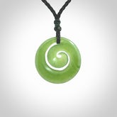 Hand carved New Zealand Kawakawa jade koru pendant. Carved for NZ Pacific by Ross Crump. Jade jewelry for sale online exclusively with NZ Pacific.
