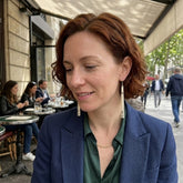 Woman wearing bone earrings