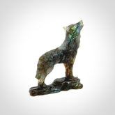 This is a hand carved wolf sculpture made from Labradorite stone.
