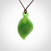 Hand carved New Zealand jade, single twist pendant. Maori pikorua pendant hand carved in New Zealand. Made by NZ Pacific, jade jewellery for sale online. One only hand made by Ross Crump.