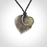 This is a hand carved Sterling Silver Kawakawa leaf pendant with New Zealand flower Jade insert. This is a medium sized necklace and is provided with an adjustable black cord.
