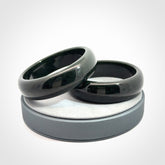 Hand carved black jade bangle. Carved from black jade. This is a solid jade bangle carved from a single piece of jade. It is polished to a soft shine. The jade is otherwise untreated and completely natural.