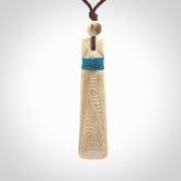 Hand carved Whale Bone Toki. One only New Zealand whale bone toki necklace for men and women. Unique New Zealand art to wear. Shipped to you on an adjustable cord.