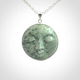 Hand made New Zealand Jade moon face necklace with Sterling Silver. Made by NZ Pacific and sale online only. Delivered with sterling silver chain and packaged in a woven kete pouch.