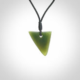 Hand carved pounamu niho, drop pendant. Jade necklace hand made in New Zealand.