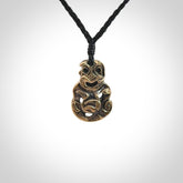 A beautiful hand made, bronze tiki pendant.