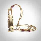 Hand carved deer antler, bone skeleton doing a head stand pendant online for sale. Creative necklace for lovers of skeletons hand made from deer antler, bone. Free shipping worldwide. We provide this pendant with an adjustable cord.