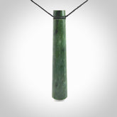 This photo shows a large jade drop shaped pendant. It a a lovely deep green Marsden jade. The cord is black and is adjustable in length. One only large, contemporary drop necklace from Jade, by Rueben Tipene.